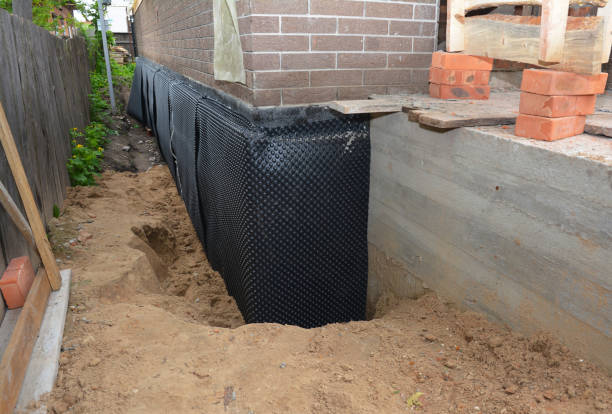 SJ Waterproofing Pros technician performing targeted Waterproofing assessment in Hampshire, IL